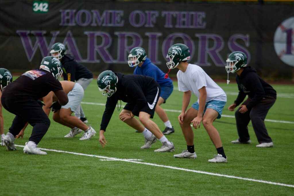 The Edmonds-Woodway defense lines up for a rep during a walk-through practice at Edmonds-Woodway High School on Oct. 20, 2025. (Joe Pohoryles / The Herald)
