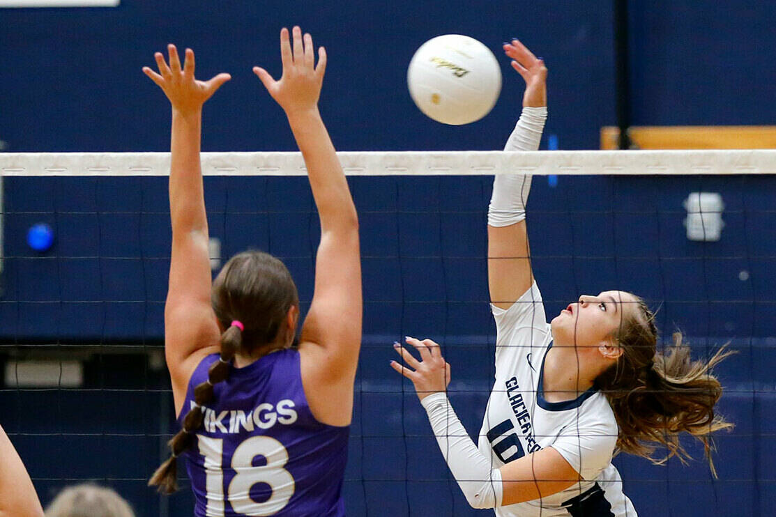 Glacier Peak’s Emma Nowak spikes the ball over the net against Lake Stevens on Tuesday, Oct. 10, 2023, at Glacier Peak High School in Snohomish, Washington. (Ryan Berry / The Herald)
