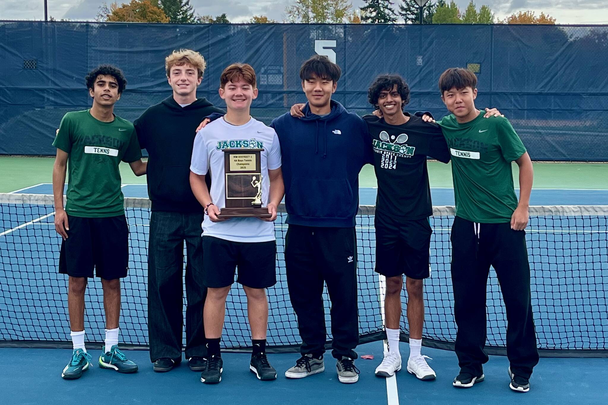 The Jackson boys tennis team poses with the District 1 4A Championship Trophy at Glacier Peak High School on Oct. 23, 2025. The team pictured left to right: Rajveer Lahankar, Andy Stark, Ashton Bergman, David Song, Arhan Sinha and Samuel Song. (Joe Pohoryles / The Herald)