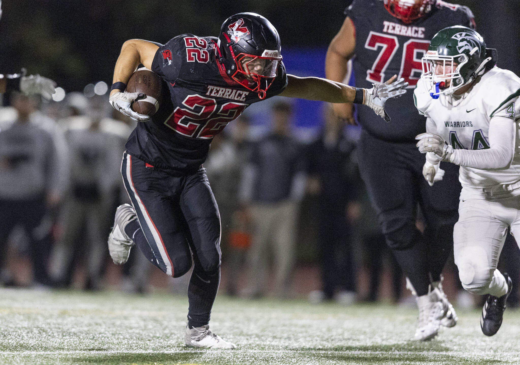 Mountlake Terrace’s Owen Boswell sticks his arm out as he runs the ball into the end zone for a touchdown during the game against Edmonds-Woodway on Oct. 23, 2025 in Edmonds, Washington. (Olivia Vanni / The Herald)