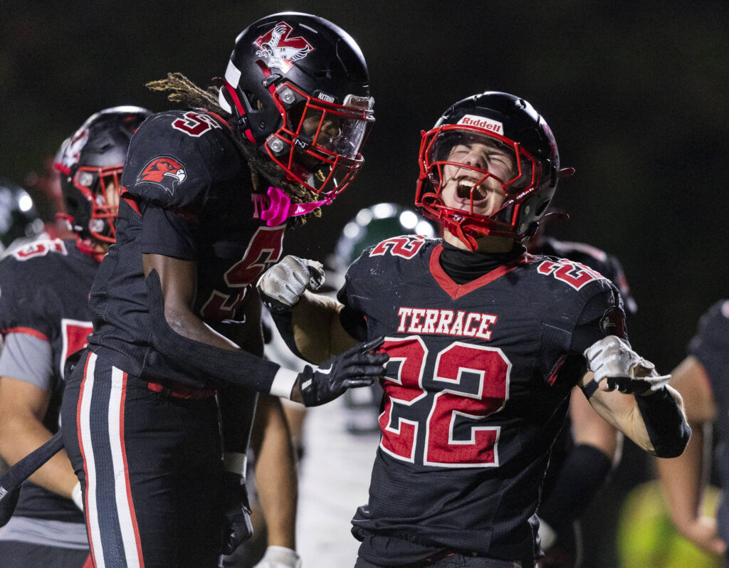 Mountlake Terrace’s Owen Boswell celebrates his touchdown with teammate Aaron Hatfield during the game against Edmonds-Woodway on Oct. 23, 2025 in Edmonds, Washington. (Olivia Vanni / The Herald)
