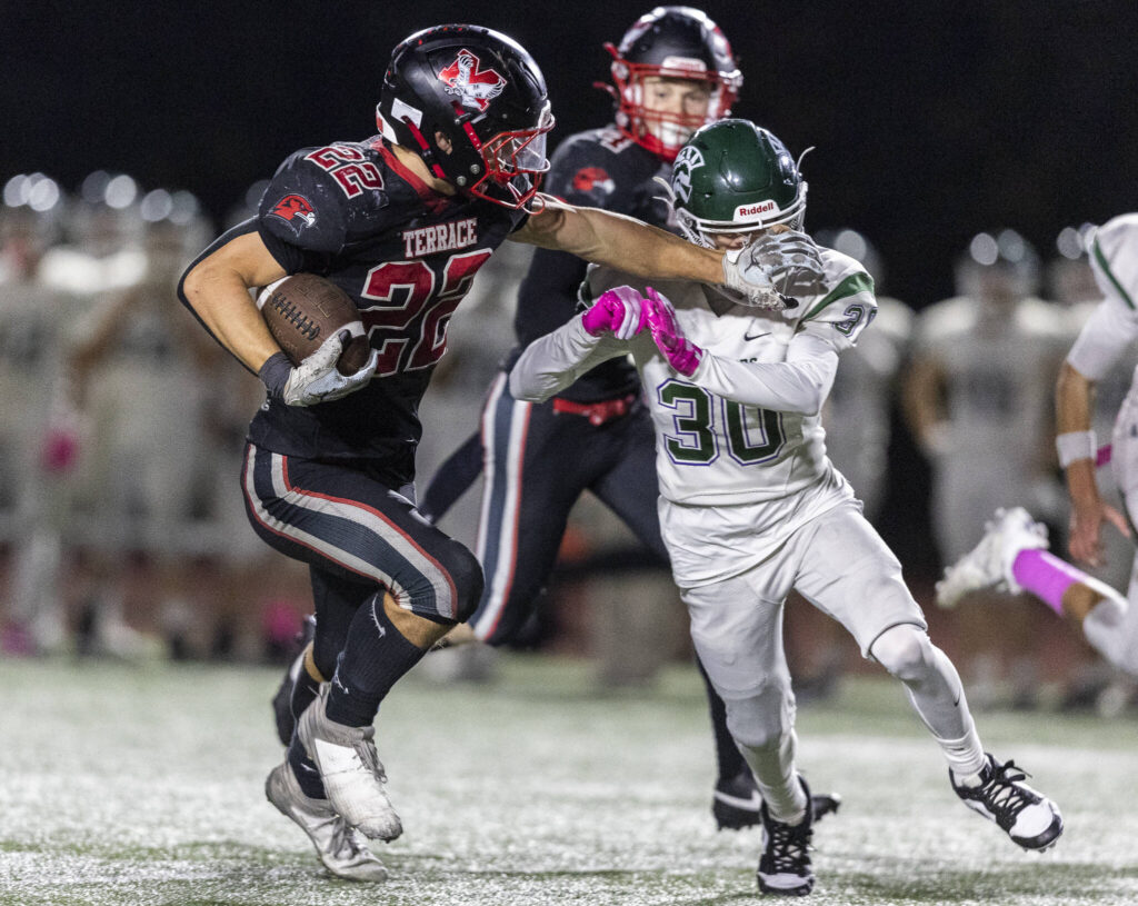 Mountlake Terrace’s Owen Boswell pushes Edmonds-Woodway’s Nicholas Stumpf as he runs the ball up the field during the game on Oct. 23, 2025 in Edmonds, Washington. (Olivia Vanni / The Herald)
