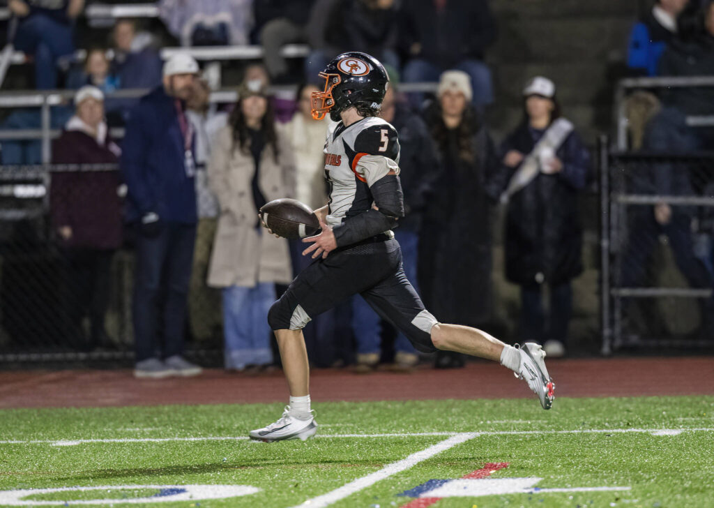 Granite Falls’ Beau Everson runs the ball up the open field into the end zone for a touchdown during the game against Cedar Park Christian on Oct. 24, 2025 in Kirkland, Washington. (Olivia Vanni / The Herald)