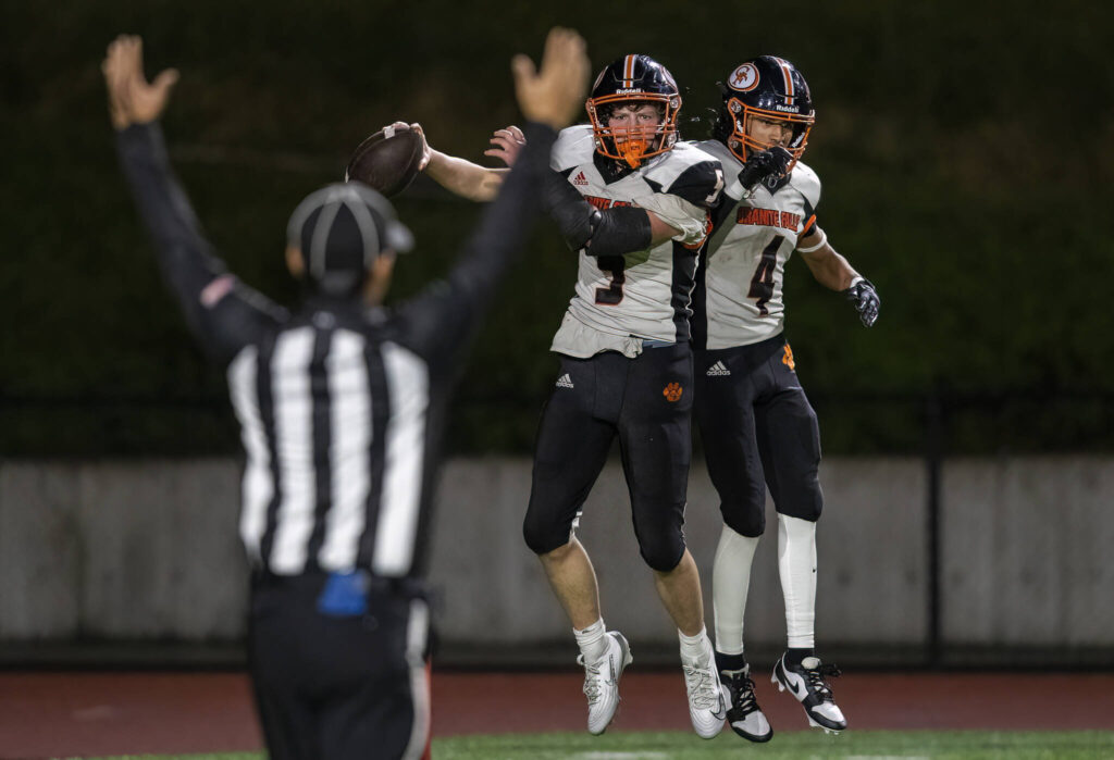 Granite Falls’ Beau Everson celebrates his touchdown with teammate Dwayne Pocknett during the game against Cedar Park Christian on Oct. 24, 2025 in Kirkland, Washington. (Olivia Vanni / The Herald)