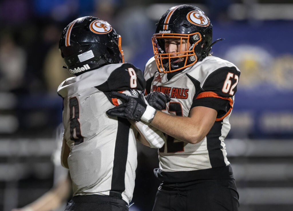 Granite Falls’ Drake Smith celebrates his touchdown with teammate Brayden Carlisle during the game against Cedar Park Christian on Oct. 24, 2025 in Kirkland, Washington. (Olivia Vanni / The Herald)