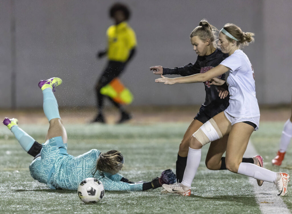 Stanwood’s Bella Braley drives to try and stop the ball as Snohomish’s Lyla Fankhauser dribbles past during the game on Oct. 27, 2025 in Snohomish, Washington. (Olivia Vanni / The Herald)