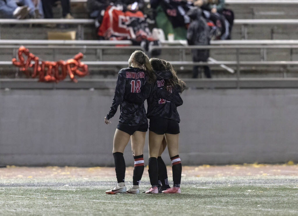 Snohomish players pose for a photo after a goal during the game against Stanwood on Oct. 27, 2025 in Snohomish, Washington. (Olivia Vanni / The Herald)