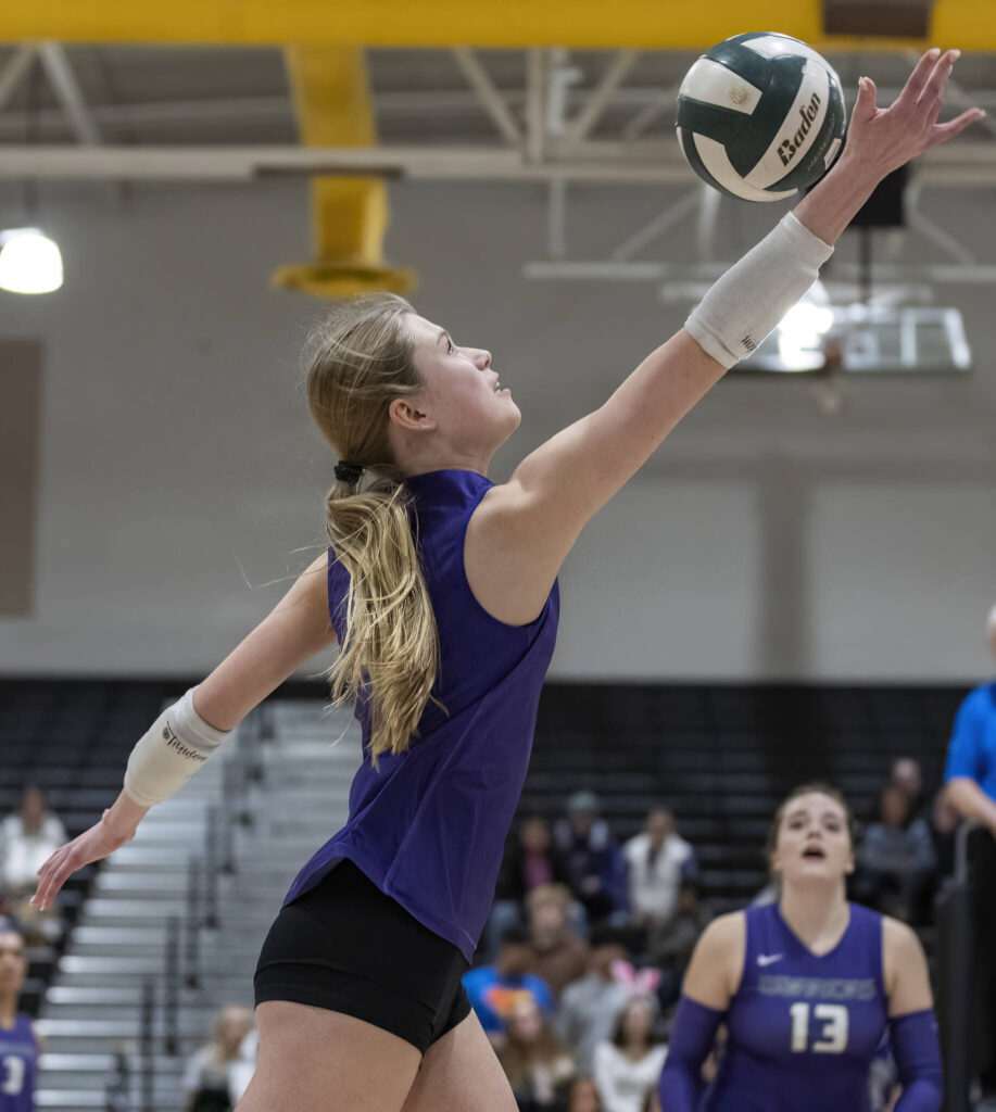 Edmonds-Woodway’s Eva Belova reaches up to tip the ball over the net during the game against Lynnwood on Oct. 29, 2025 in Edmonds, Washington. (Olivia Vanni / The Herald)
