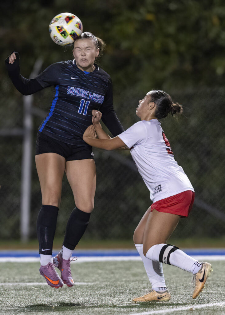 Shorewood’s Sky Helstad heads the ball during the 3A district game against Mountlake Terrace on Oct. 30, 2025 in Shoreline, Washington. (Olivia Vanni / The Herald)
