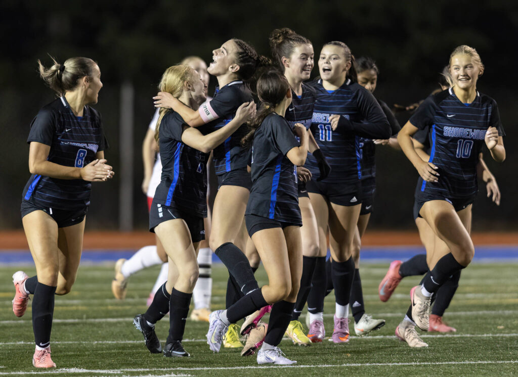 Shorewood players celebrate scoring against Mountlake Terrace during the 3A district game on Oct. 30, 2025 in Shoreline, Washington. (Olivia Vanni / The Herald)
