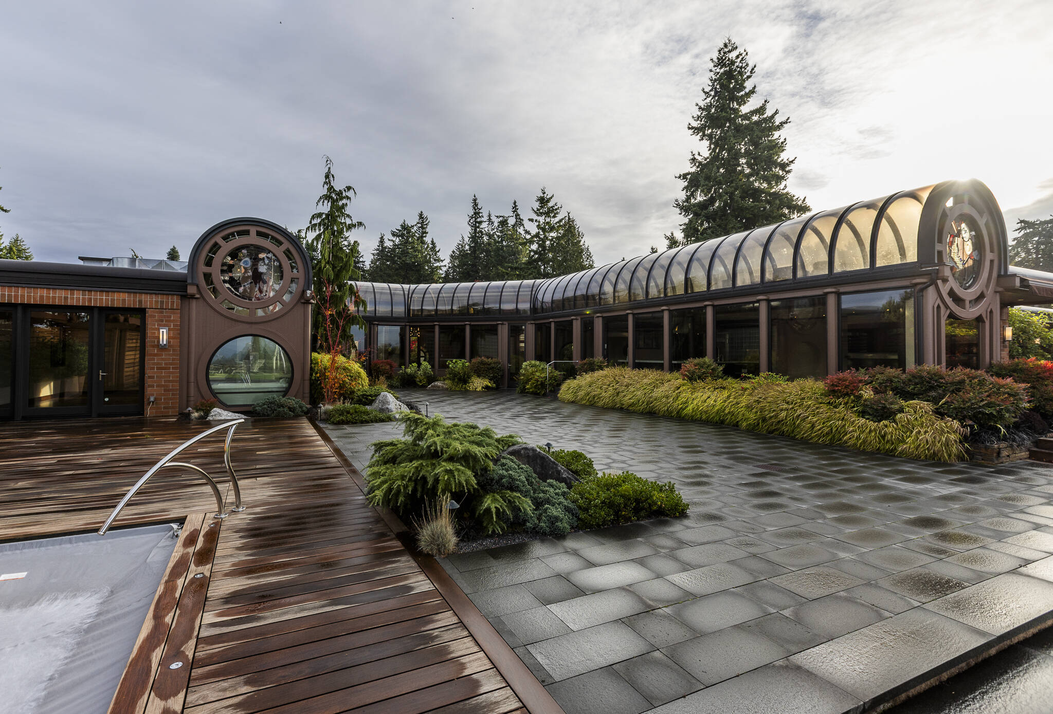 The back patio area and deck of the $6 million glass house for sale on Oct. 23, 2025 in Mukilteo. (Olivia Vanni / The Herald)