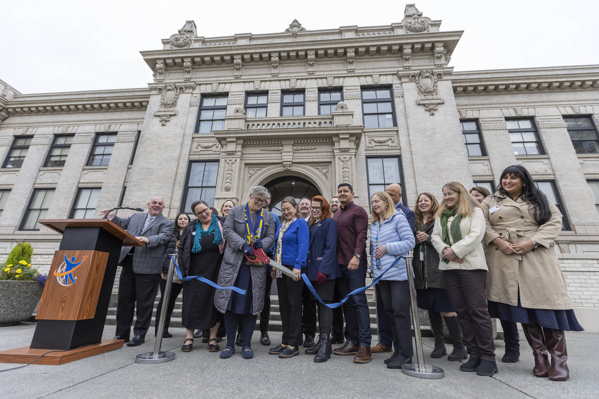 Everett High School Principal Kelly Shepard along with local politicians and community members cut a ceremonial ribbon outside of Everett High School to celebrate the opening of the new Student Health Clinic on Oct. 30, 2025 in Everett, Washington. (Olivia Vanni / The Herald)