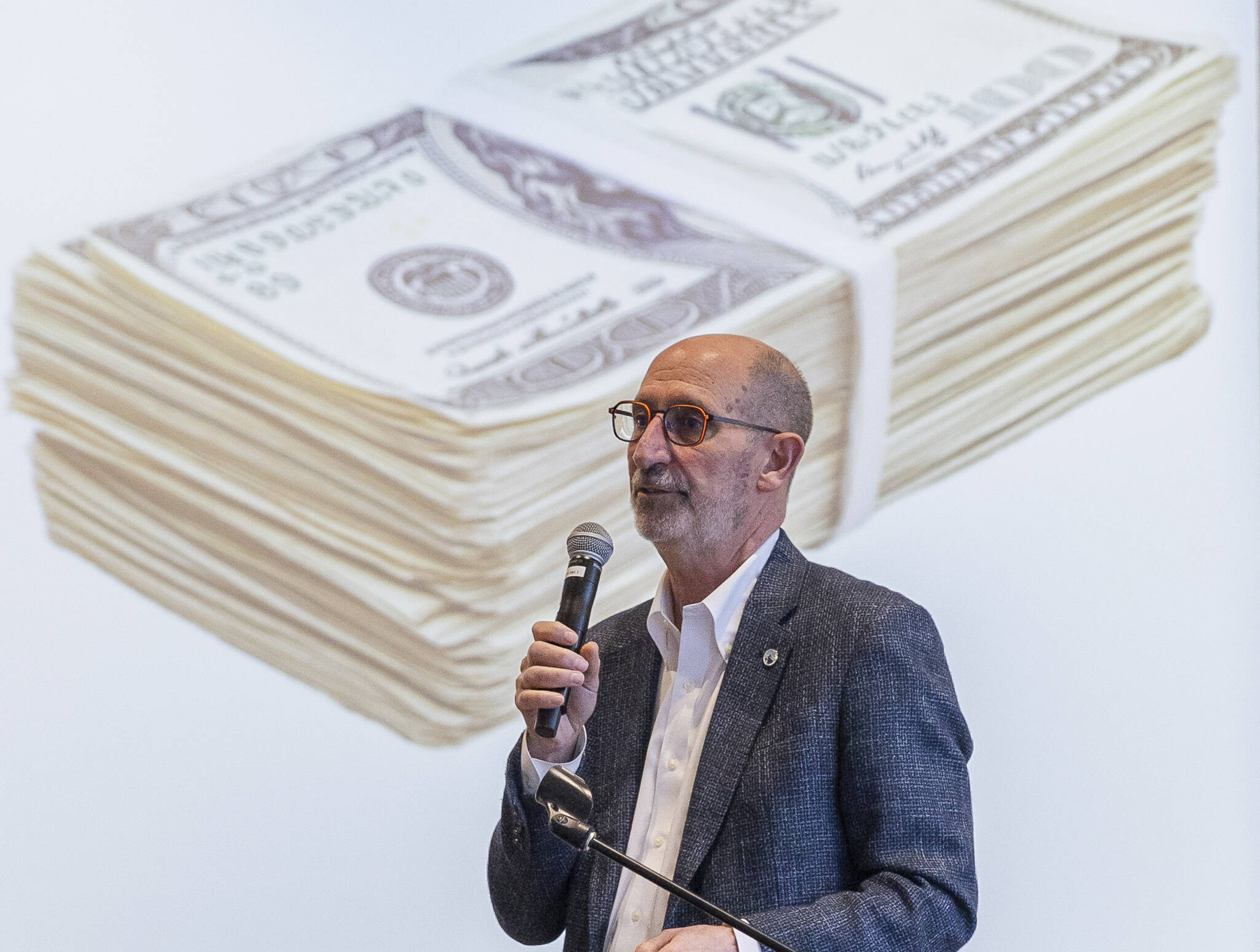 Edmonds Mayor Mike Rosen goes through an informational slideshow about the current budget situation in Edmonds during a roundtable event at the Edmonds Waterfront Center on Monday, April 7, 2025 in Edmonds, Washington. (Olivia Vanni / The Herald)