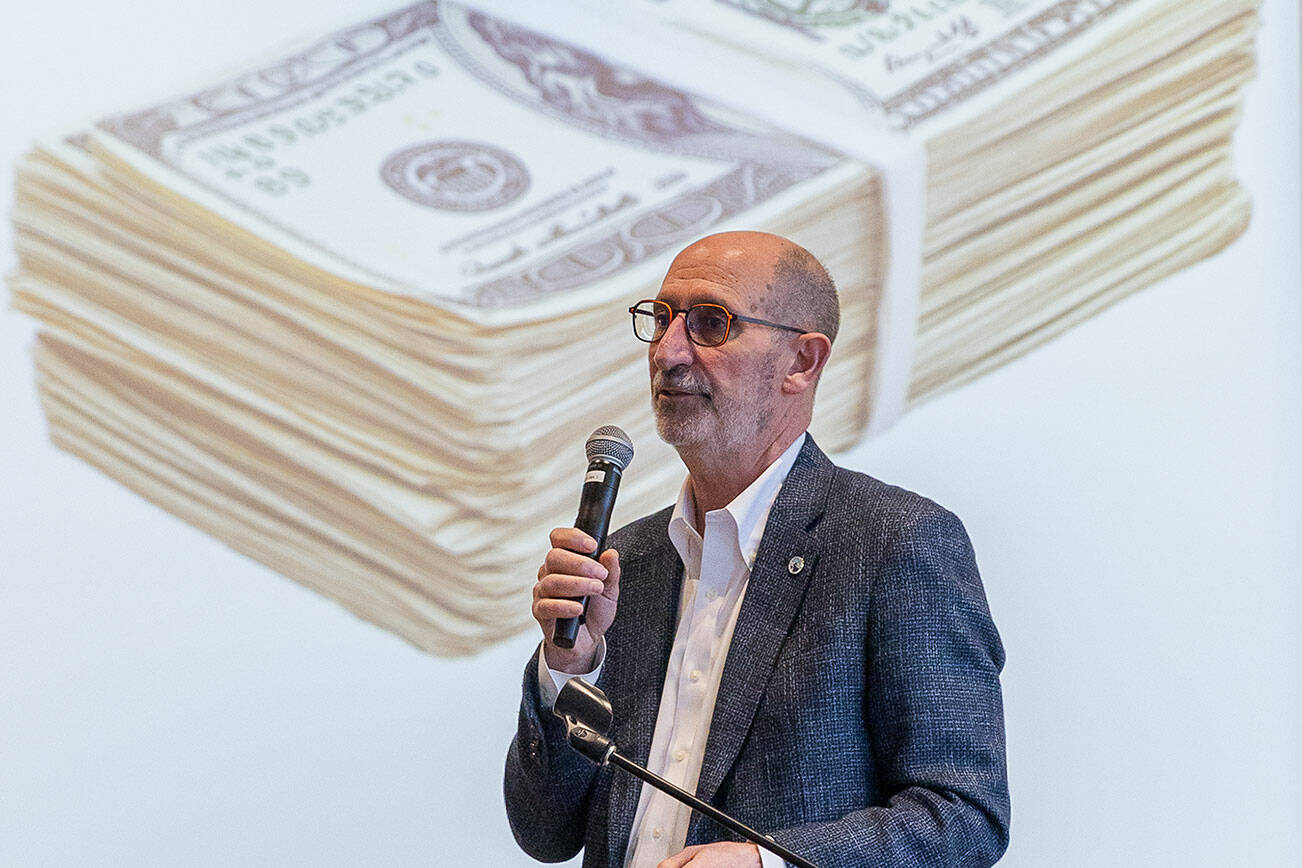 Edmonds Mayor Mike Rosen goes through an informational slideshow about the current budget situation in Edmonds during a roundtable event at the Edmonds Waterfront Center on Monday, April 7, 2025 in Edmonds, Washington. (Olivia Vanni / The Herald)