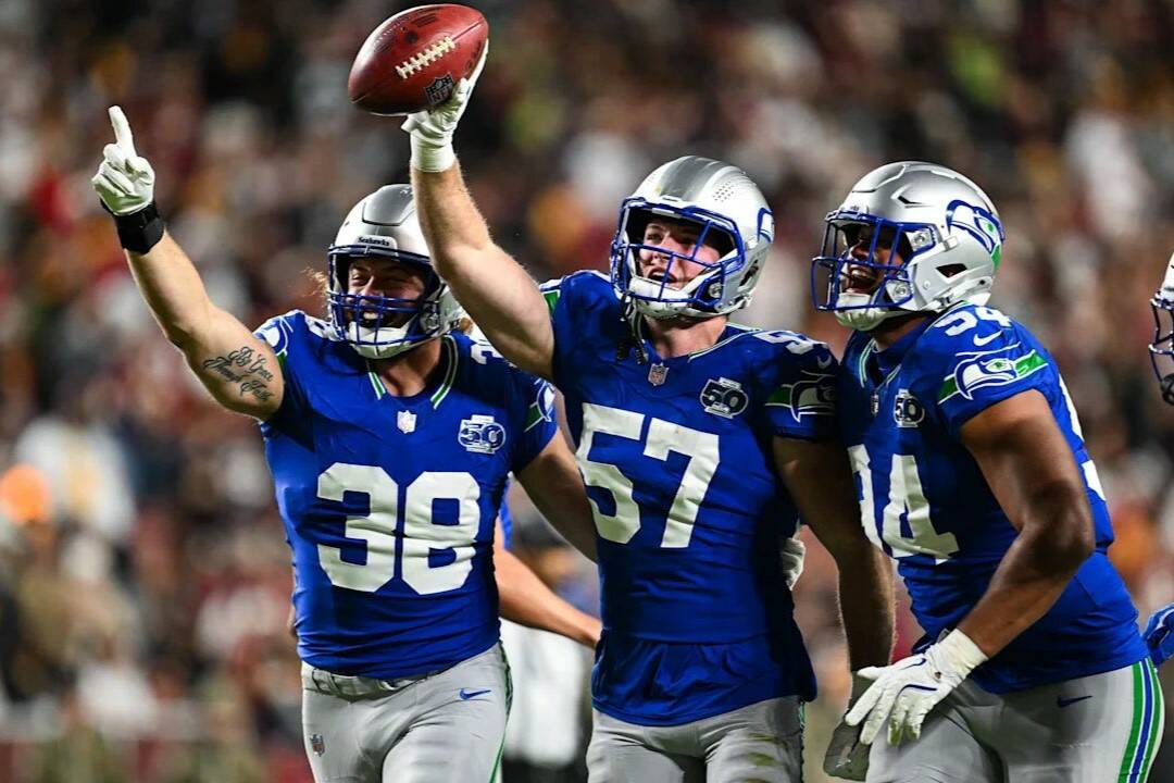 Seahawks linebacker Connor O'Toole (57) celebrates a fumble recovery with Brady Russell (38) and Mike Morris (94) during a 38-14 win over the Washington Commanders at Northwest Stadium in Landover, Maryland on Sunday, Nov. 2, 2025. (Photo courtesy of the Seattle Seahawks)