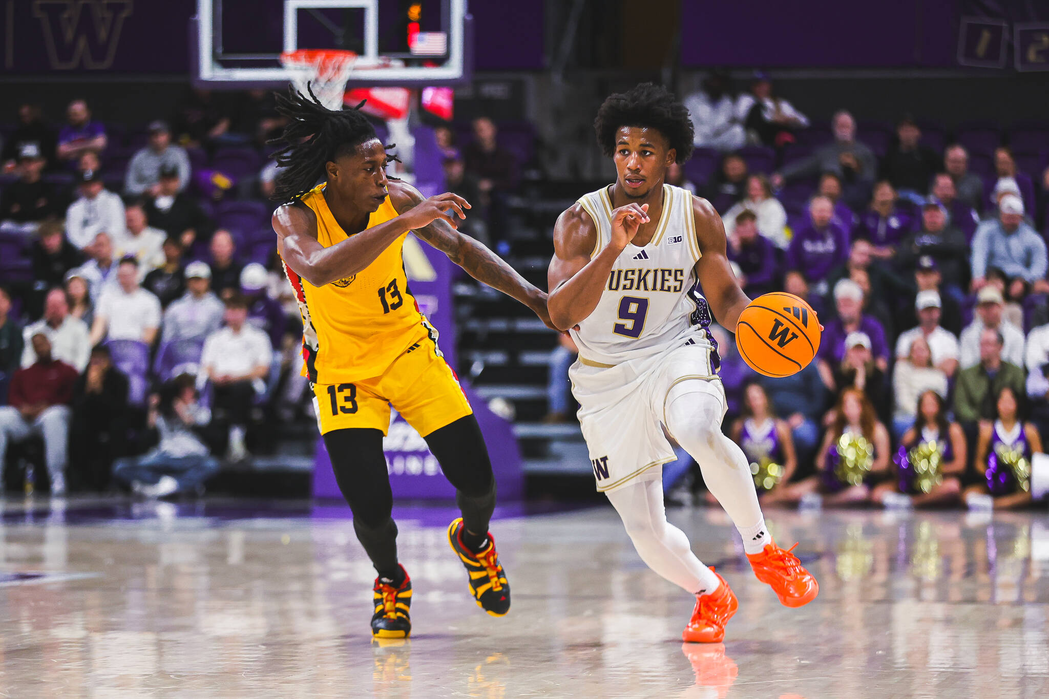Washington Huskies guard Wesley Yates III (9) drives by Arkansas-Pine Bluff's Quion Williams (13) on Monday, Nov. 4, 2025 at Hec Edmundson Pavilion in Seattle, Washington. (Photo courtesy of Washington Athletics)