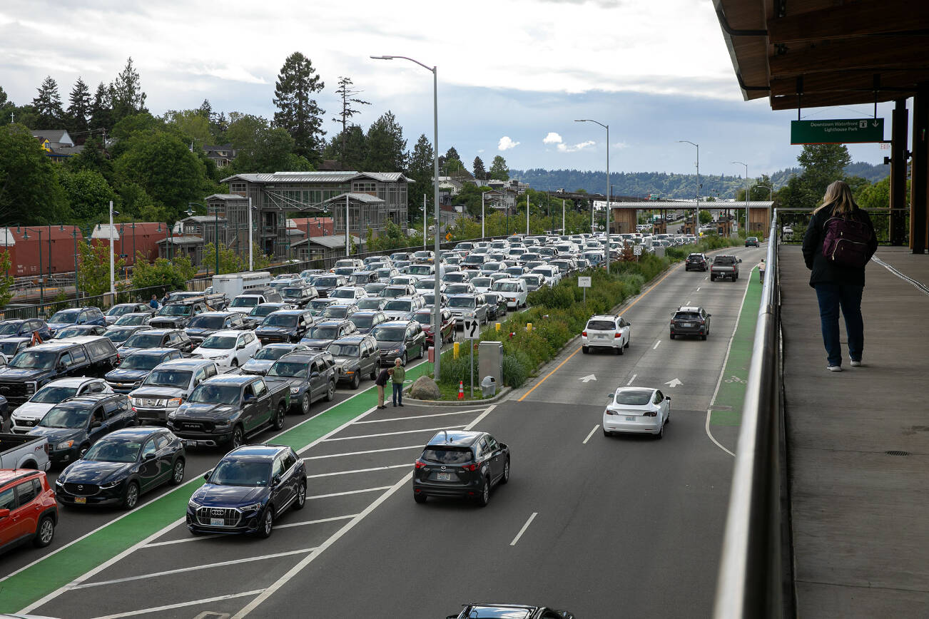 Vehicles pack the line for the Mukilteo-Clinton ferry as they wait to board on Wednesday, May 29, 2024, in Mukilteo, Washington. (Ryan Berry / The Herald)