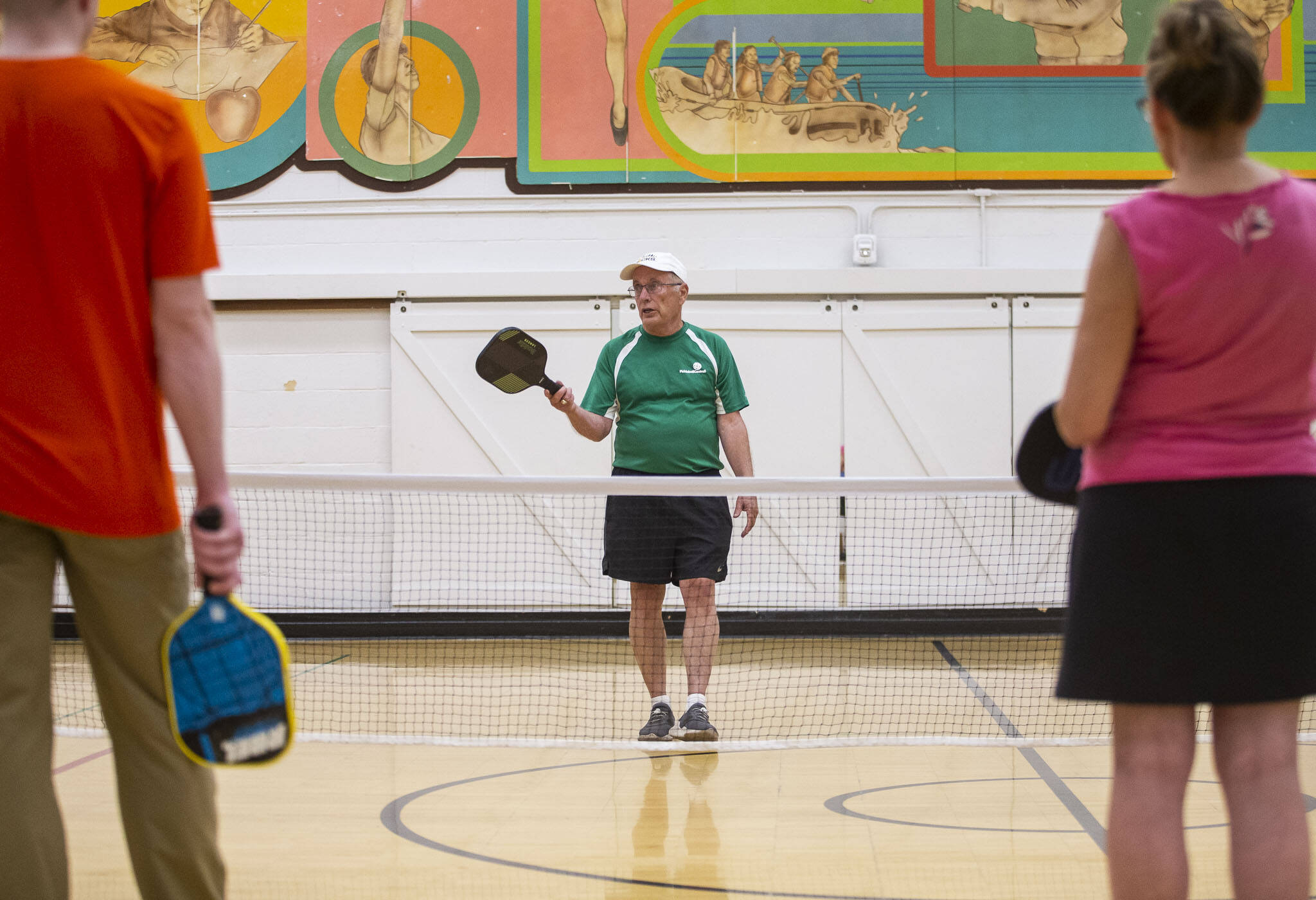 Roger Bel Air teaches a beginners pickleball clinic at the Frances Anderson Center on Monday, July 31, 2023 in Edmonds, Washington. (Olivia Vanni / The Herald)
