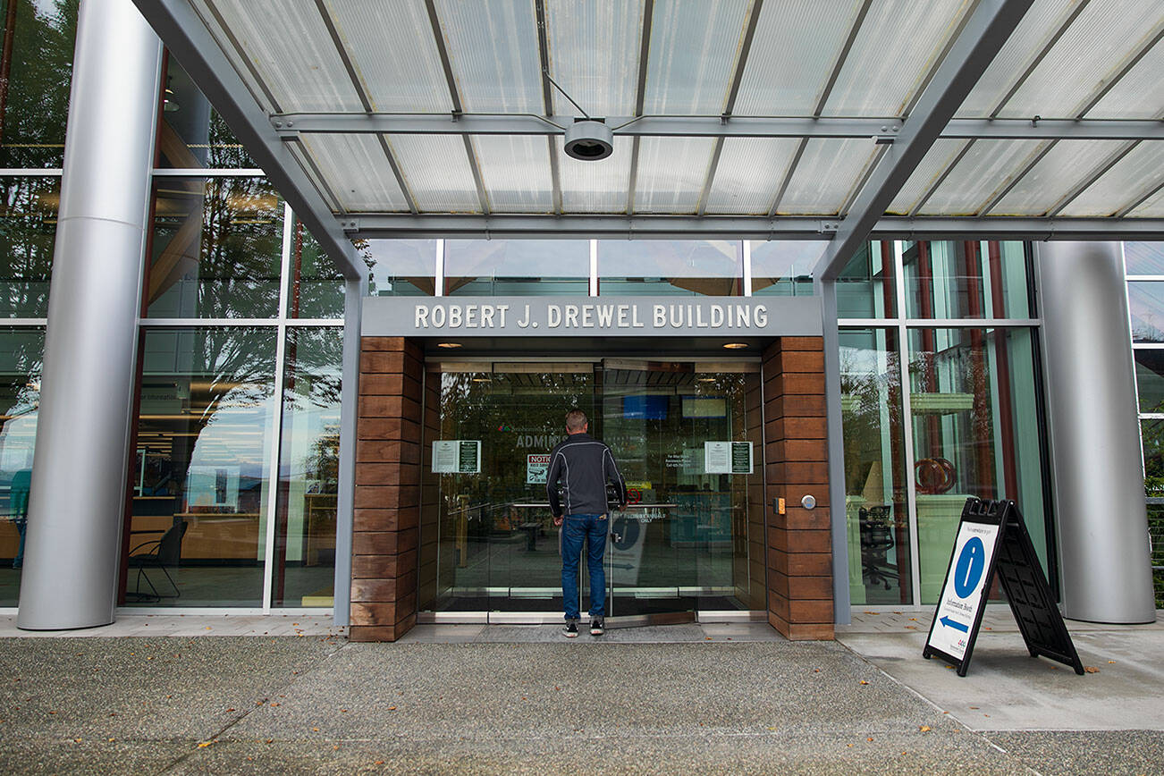 A person enters the Robert J. Drewel Building on Friday, Nov. 3, 2023, at the county campus in downtown Everett, Washington. (Ryan Berry / The Herald)