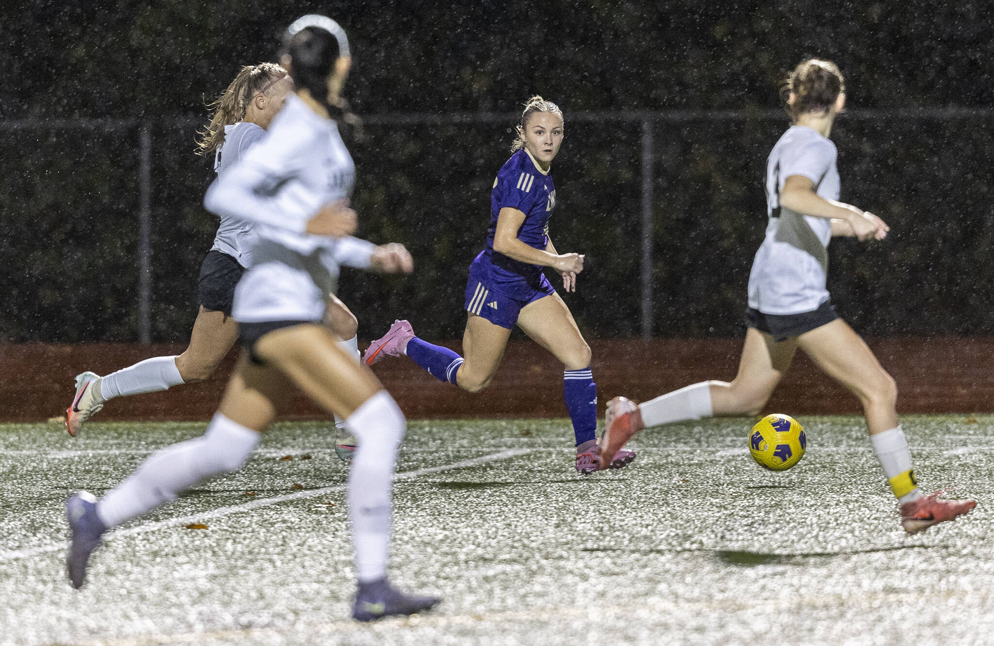 Lake Stevens Shelby Clifton dribbles the ball upfield while Jackson defends during the 4A girls district game on Nov. 5, 2025 in Lake Stevens, Washington. (Olivia Vanni / The Herald)