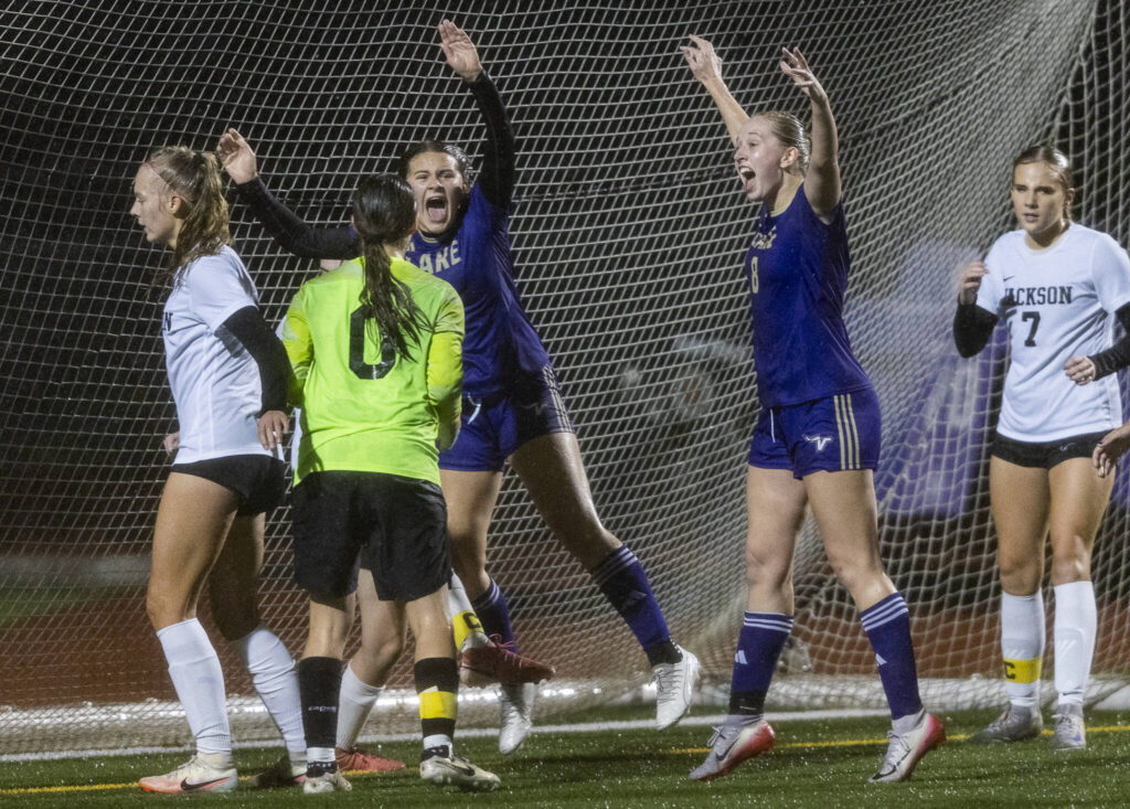 Lake Stevens’ Cora Jones yells in unison with teammate Carley Robertson after scoring a goal during the 4A girls district game against Jackson on Nov. 5, 2025 in Lake Stevens, Washington. (Olivia Vanni / The Herald)
