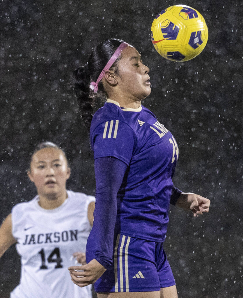Lake Stevens’ Keira Isabelle Tupua heads the ball during the 4A girls district game against Jackson on Nov. 5, 2025 in Lake Stevens, Washington. (Olivia Vanni / The Herald)
