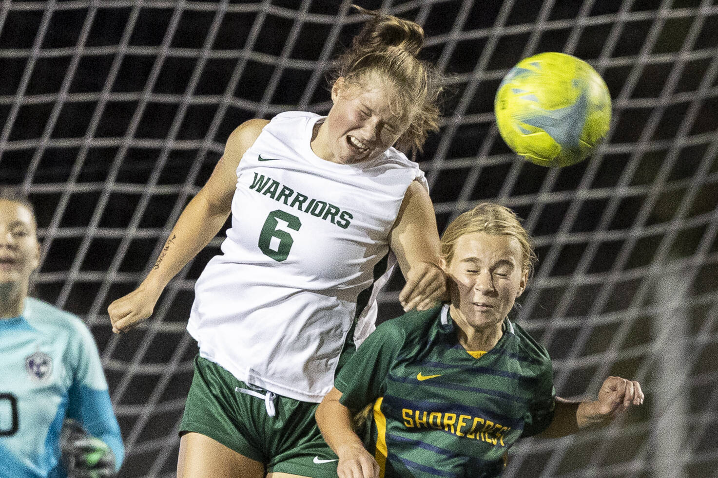 Edmonds-Woodway’s Liliana Frank heads the ball above Shorecrest’s Cora Quinn during the game on Sept. 23, 2025 in Shoreline, Washington. (Olivia Vanni / The Herald)