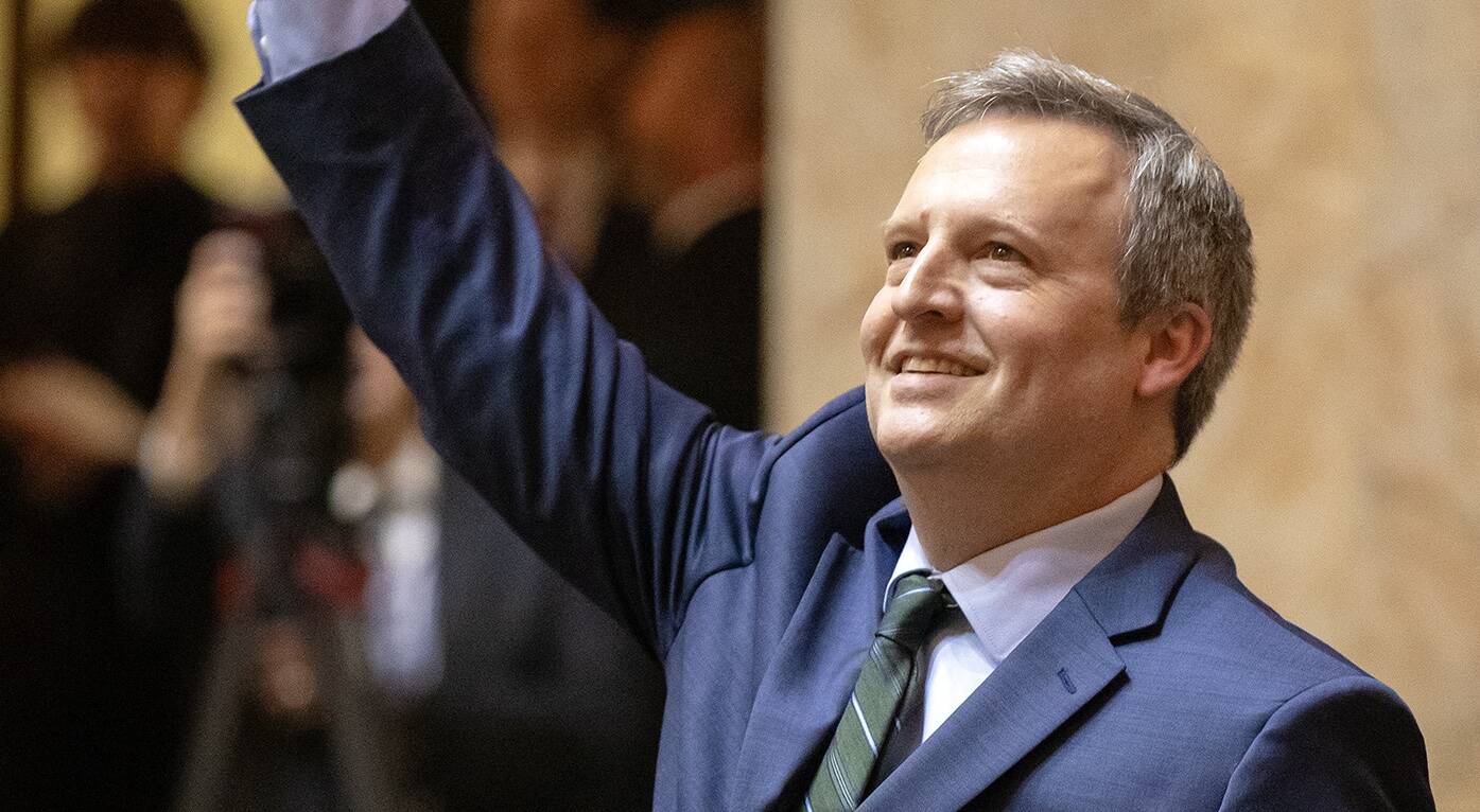 Washington state Commissioner of Public Lands Dave Upthegrove waves to the crowd during inauguration ceremonies at the Washington state Capitol, in Olympia, on Jan. 15, 2025. (Photo by Ryan Berry/Washington State Standard)