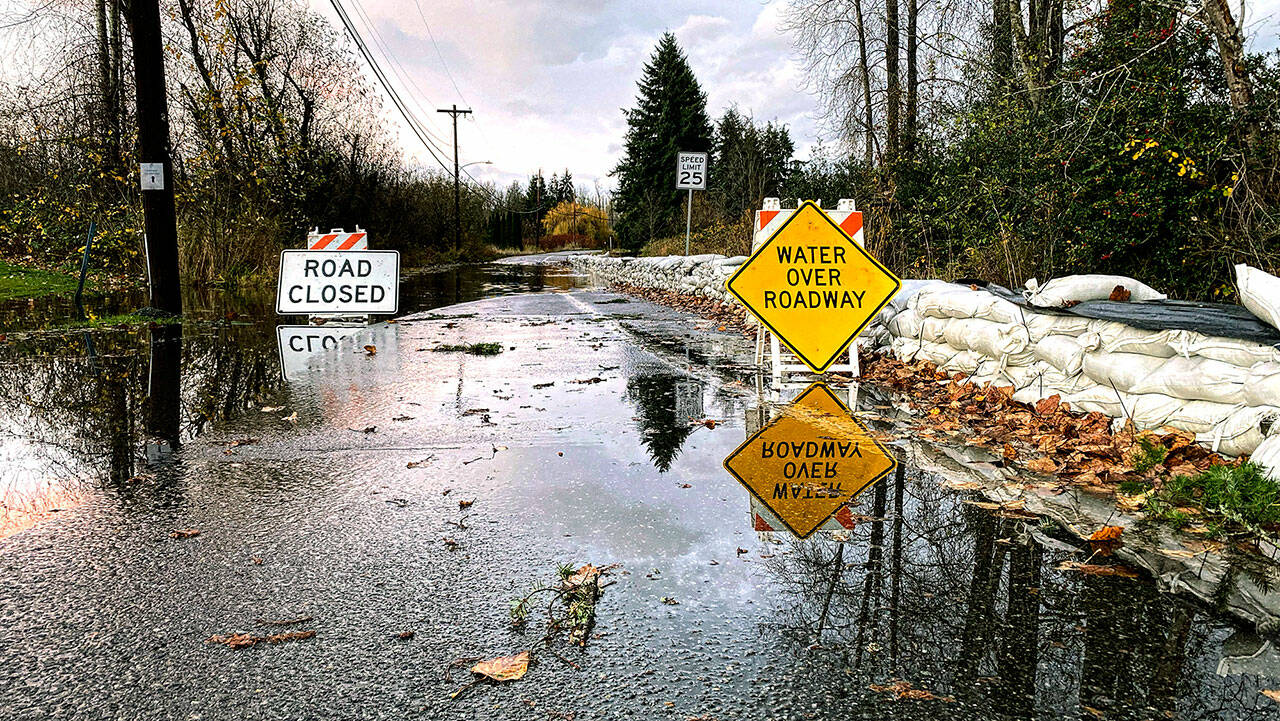 The Lake Stevens outlet channel, also known as Stevens Creek, topped Hartford Drive during record rainfall on Nov. 15. The city is planning to conduct future studies on how to address downtown flooding. (Isabella Breda / The Herald) 20211205