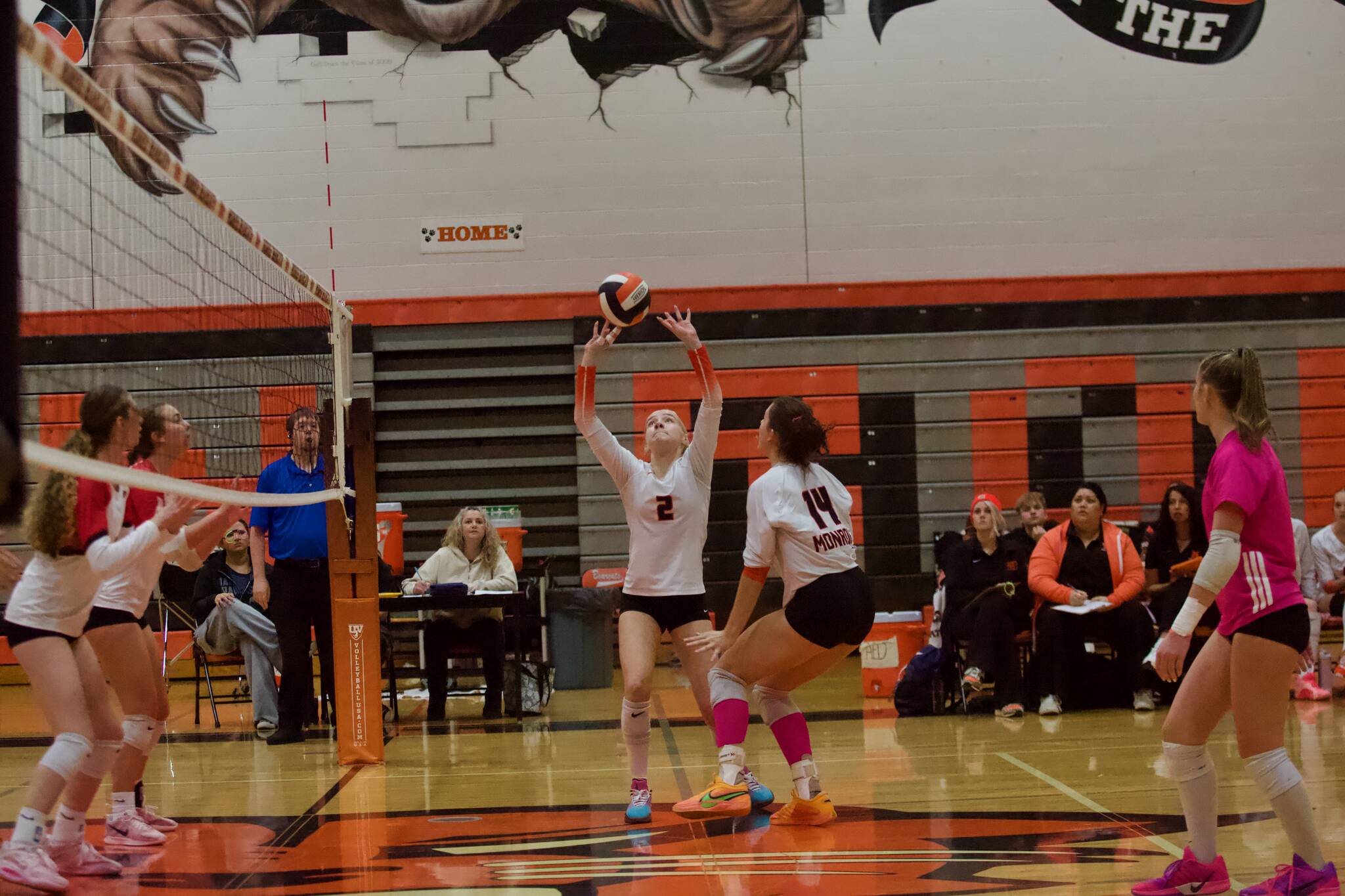 Monroe freshman Naia Atalig (2) sets the ball up for junior Kiah Dunbar (14) during the Bearcats' 3-1 win against Snohomish in the District 1 3A quarterfinals at Monroe High School on Nov. 11, 2025. (Joe Pohoryles / The Herald)