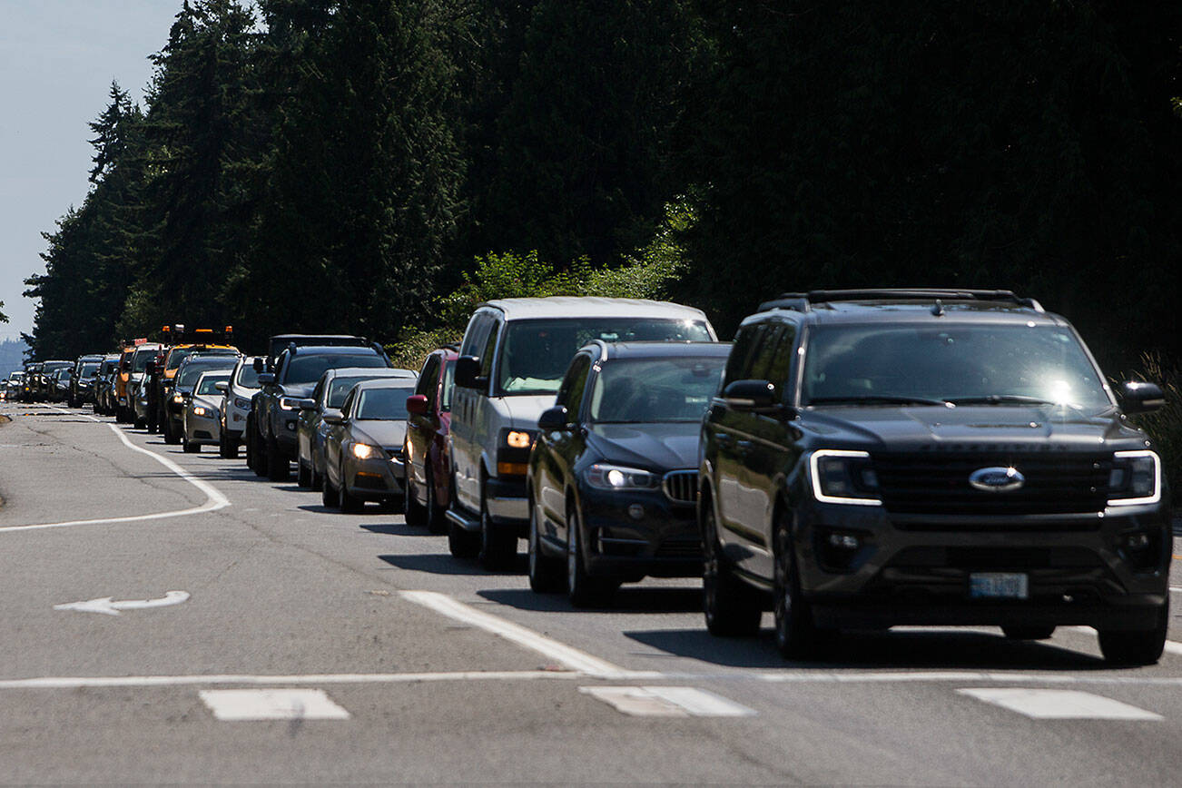 Cars headed north on Highway 9 line up south of the light at 30th Street on Friday, July 9, 2021 in Snohomish, Wa. (Olivia Vanni / The Herald)