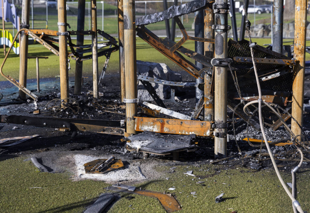 Remnants of the portion of the Wiggums Hollow playground that recently burned on Nov. 19, 2025 in Everett, Washington. (Olivia Vanni / The Herald)

