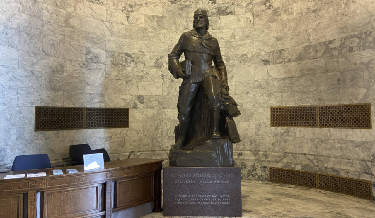 A bronze statue of Marcus Whitman in the Washington state Capitol building weighs over 9,000 pounds with its stone base. (Jacquelyn Jimenez Romero / Washington State Standard)