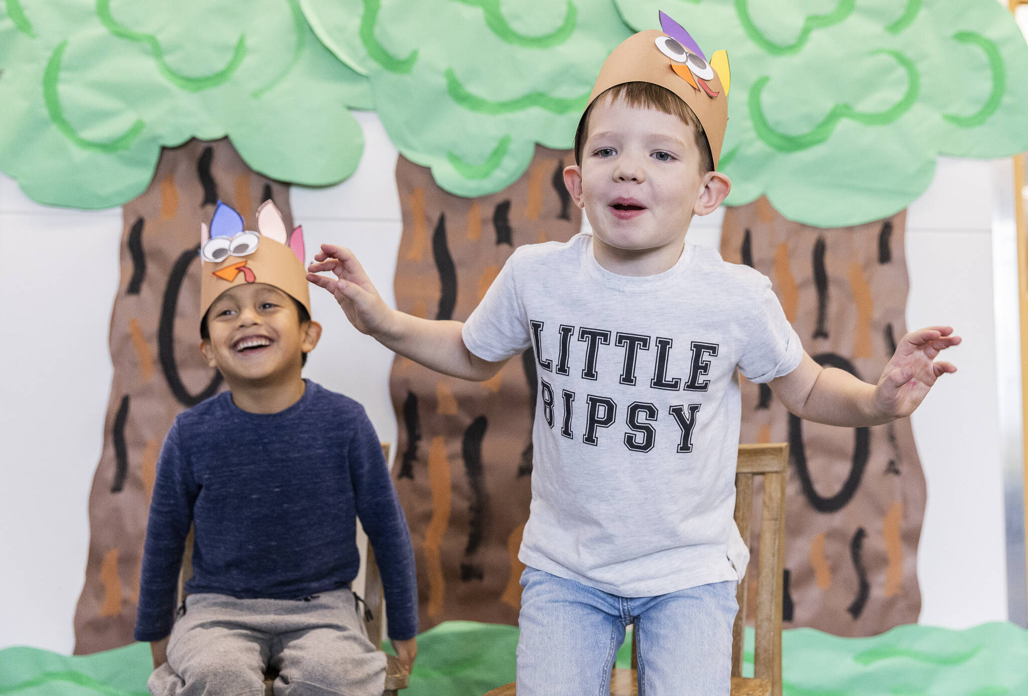 Stevens Creek kindergartener Lucas Angeles Carmona, 5, left, laughs while Rogue Jones, 5, imitates a turkey’s walk on Nov. 20, 2025 in Lake Stevens, Washington. (Olivia Vanni / The Herald)