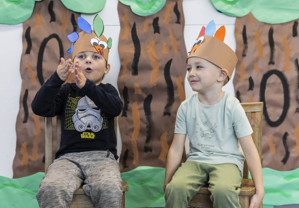 Stevens Creek kindergarteners Rowen Holme, 5, left, and Chase McMail, 6, answer how much food they eat on Thanksgiving on Nov. 20, 2025 in Lake Stevens, Washington. (Olivia Vanni / The Herald)
