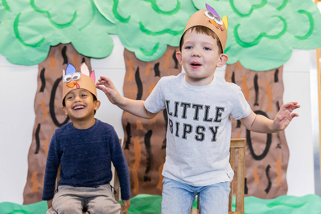 Stevens Creek kindergartener Lucas Angeles Carmona, 5, left, laughs while Rogue Jones, 5, imitates a turkey’s walk on Nov. 20, 2025 in Lake Stevens, Washington. (Olivia Vanni / The Herald)