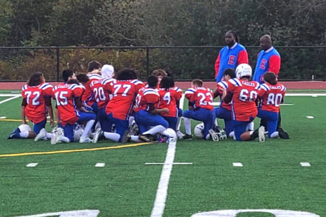 The Explorer Middle School tackle football team is coached by Coach Nicholson and Coach Lewin. (Cory Armsrong-Hoss)