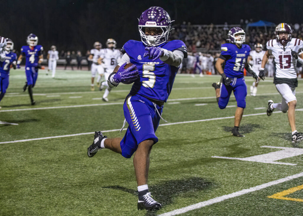 Lake Stevens’ Jayvian Ferrell runs the ball into the end zone for a touchdown during the 4A state football quarterfinal game against Moses Lake on Nov. 22, 2025 in Lake Stevens, Washington. (Olivia Vanni / The Herald)
