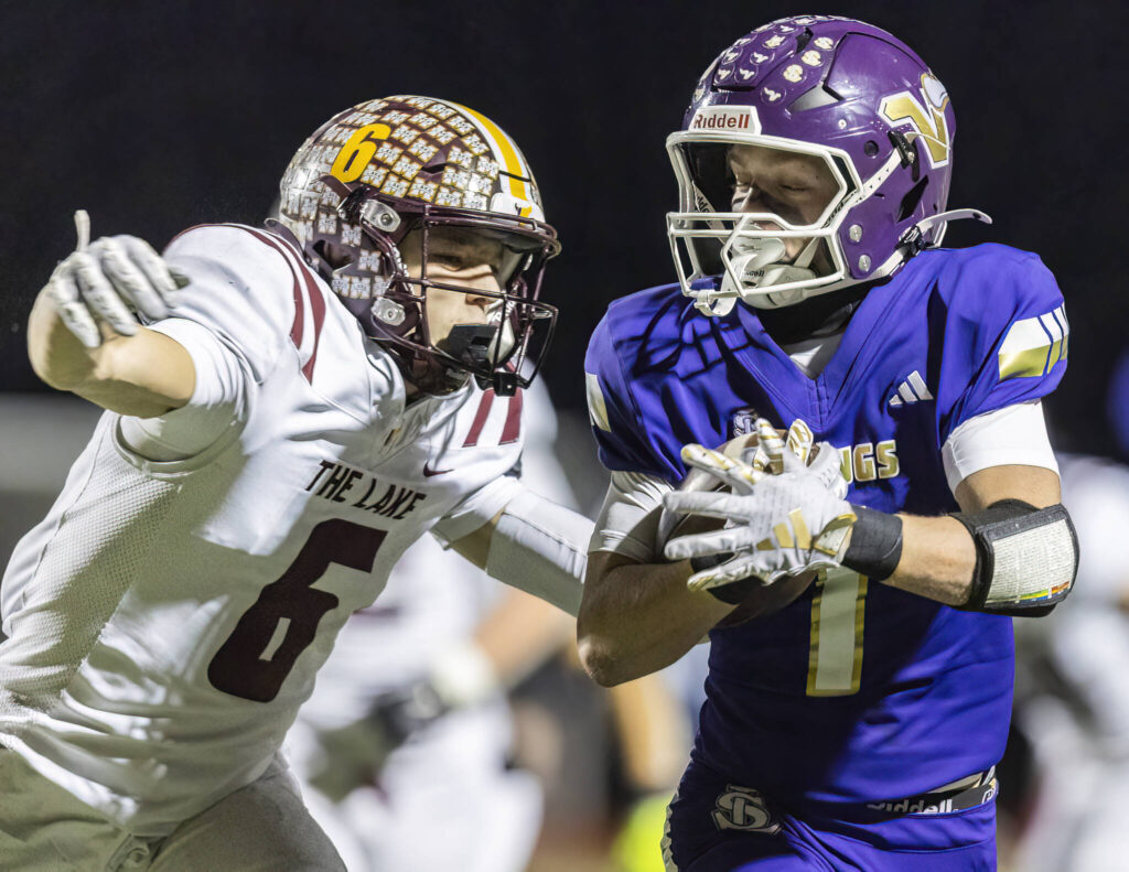 Lake Stevens’ Colten Fink runs the ball into the end zone for a touchdown during the 4A state football quarterfinal game against Moses Lake on Nov. 22, 2025 in Lake Stevens, Washington. (Olivia Vanni / The Herald)
