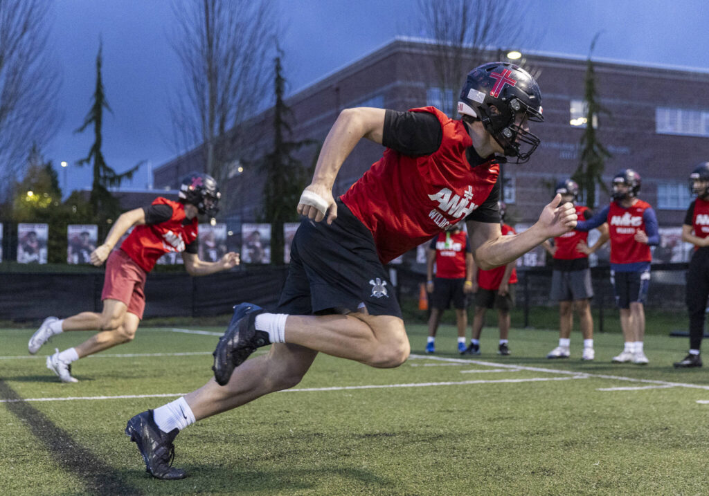 Archbishop Murphy’s Jack Sievers and Henry Gabalis race during a warm up on Nov. 24, 2025 in Everett, Washington. (Olivia Vanni / The Herald)
