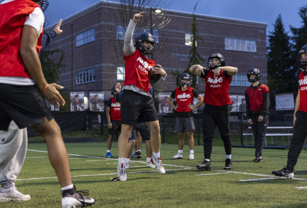 Archbishop Murphy players cheers after a race during practice on Nov. 24, 2025 in Everett, Washington. (Olivia Vanni / The Herald)
