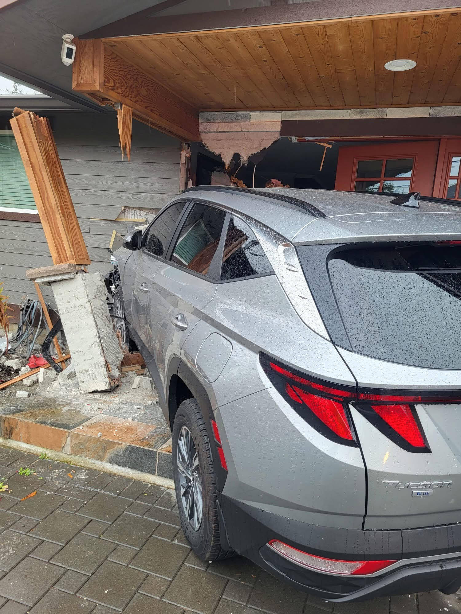 A car crashed into an Everett home on Monday, injuring two. (Everett Fire Department)