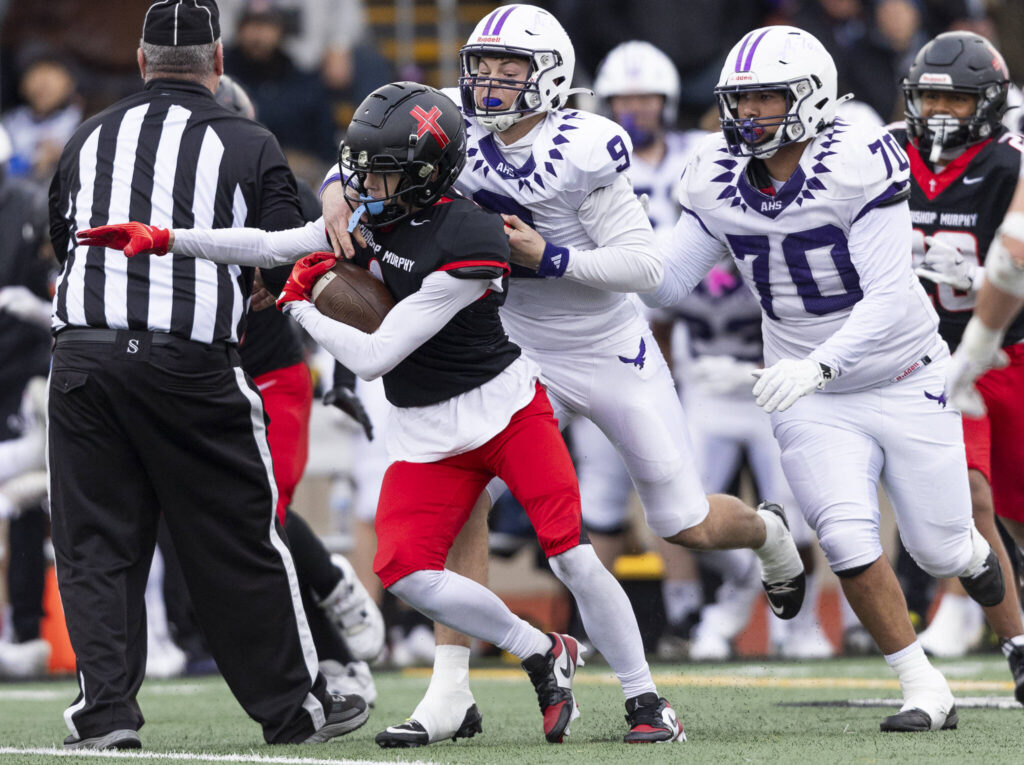 Archbishop Murphy’s Javen Latta runs the ball upfield after intercepting the ball during the 2A state football semifinal game against Anacortes on Nov. 29, 2025 in Everett, Washington. (Olivia Vanni / The Herald)
