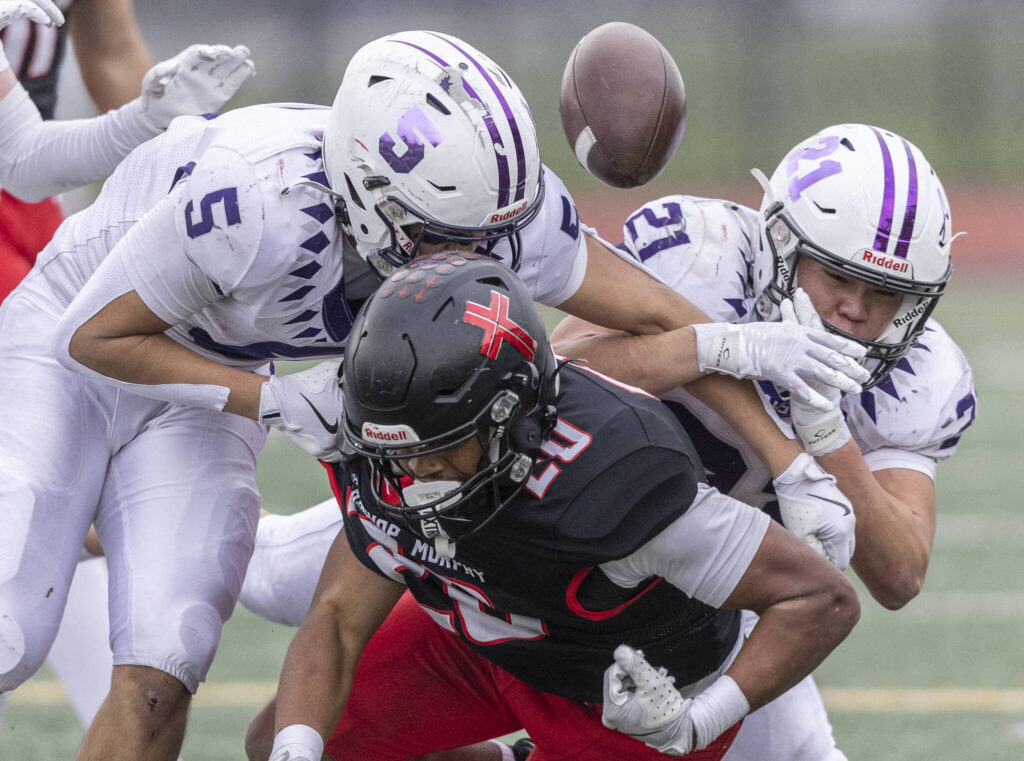 Archbishop Murphy’s Isaiah Smith fumbles the ball during the 2A state football semifinal game against Anacortes on Nov. 29, 2025 in Everett, Washington. (Olivia Vanni / The Herald)
