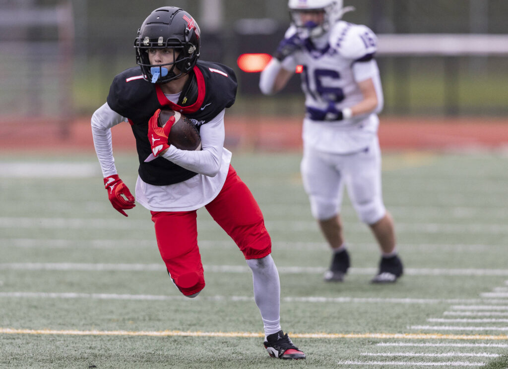 Archbishop Murphy’s Javen Latta runs the ball upfield after intercepting the ball during the 2A state football semifinal game against Anacortes on Nov. 29, 2025 in Everett, Washington. (Olivia Vanni / The Herald)
