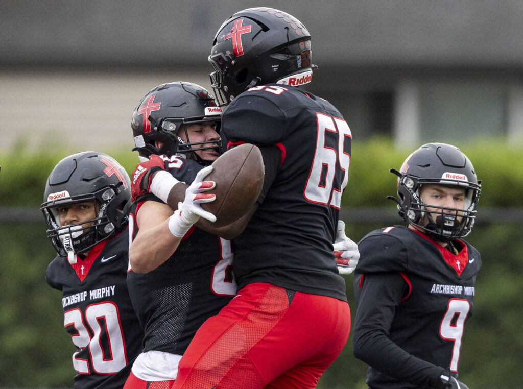 Archbishop Murphy’s Jack Sievers celebrates his touchdown with Hakeim Smalls during the 2A state football semifinal game against Anacortes on Nov. 29, 2025 in Everett, Washington. (Olivia Vanni / The Herald)
