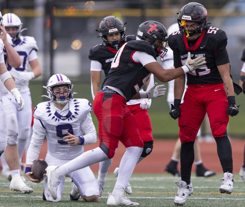 Archbishop Murphy’s Tayden Olson celebrates after sacking Anacortes’ Ryan Harrington during the 2A state football semifinal game on Nov. 29, 2025 in Everett, Washington. (Olivia Vanni / The Herald)
