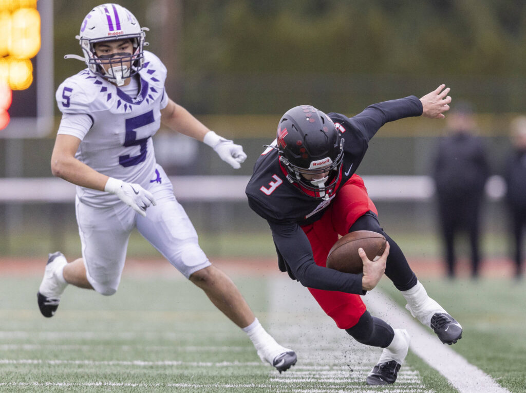 Archbishop Murphy’s Evan Ruiz runs the ball upfield during the 2A state football semifinal game against Anacortes on Nov. 29, 2025 in Everett, Washington. (Olivia Vanni / The Herald)
