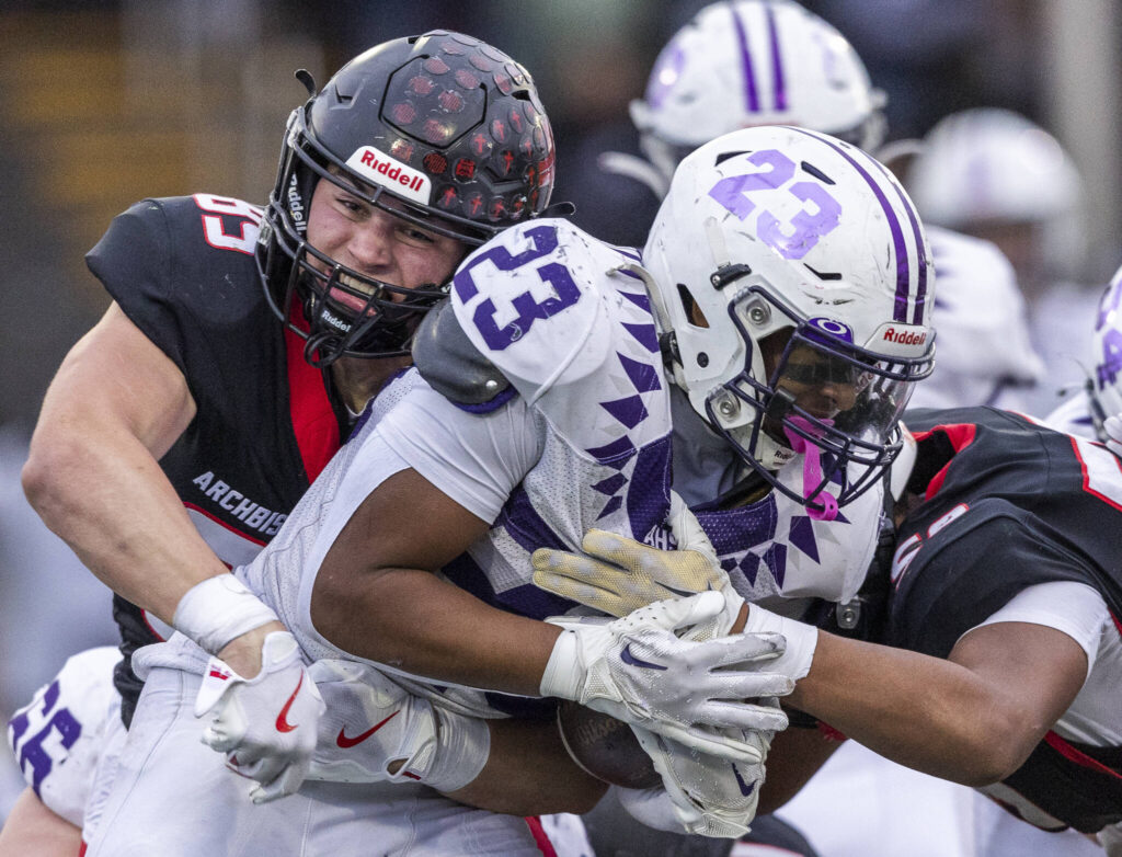 Archbishop Murphy’s Jack Sievers gets a stop on third down during the 2A state football semifinal game against Anacortes on Nov. 29, 2025 in Everett, Washington. (Olivia Vanni / The Herald)
