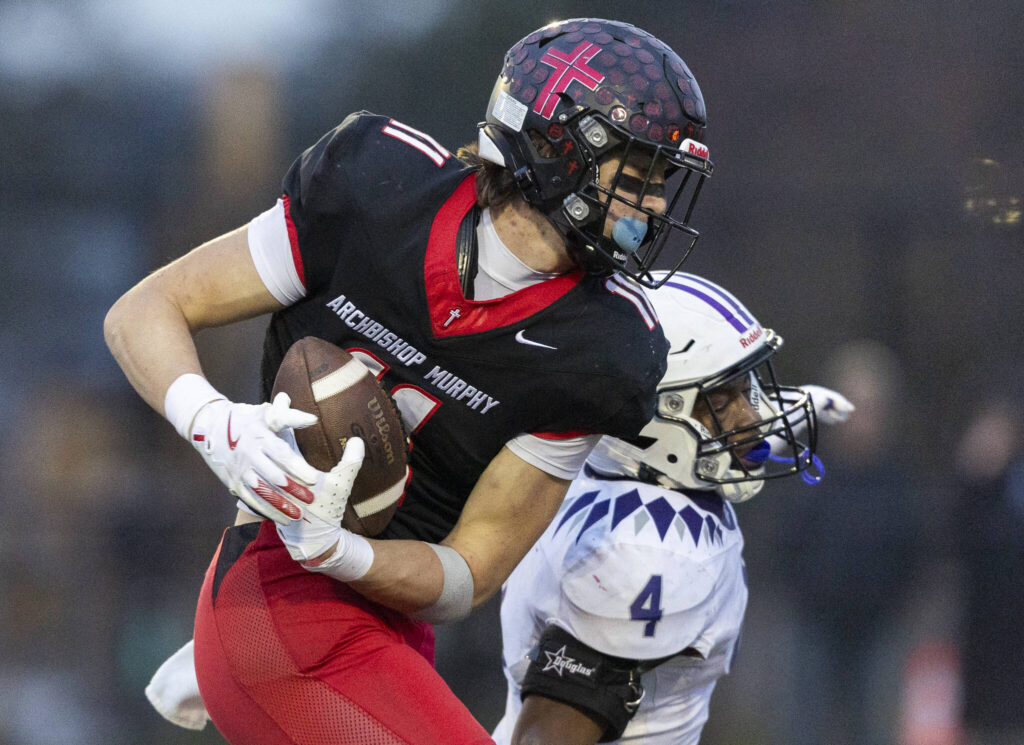 Archbishop Murphy’s Henry Gabalis shakes a tackle to run the ball into the end zone for a touchdown during the 2A state football semifinal game against Anacortes on Nov. 29, 2025 in Everett, Washington. (Olivia Vanni / The Herald)
